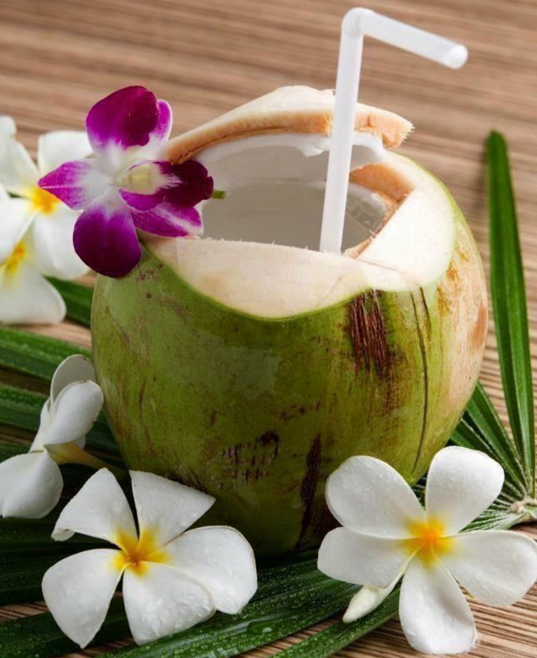 straw and flowers in coconut